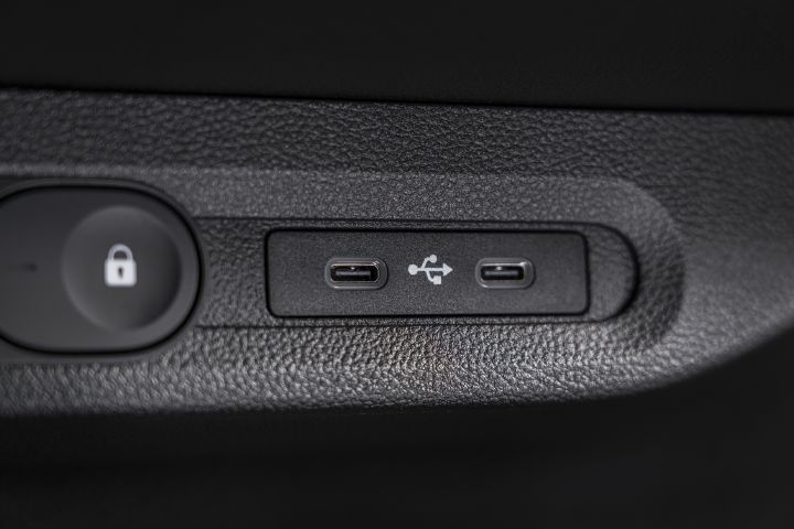 Focus on lock button with white padlock icon, and USB port.