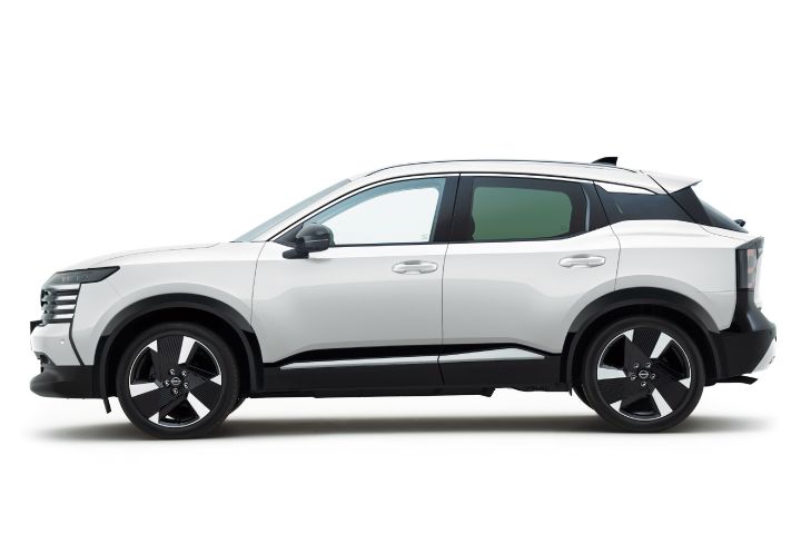 Side view of a white Nissan Kicks. The vehicle faces right, clearly showing its proportions against a clean white background.