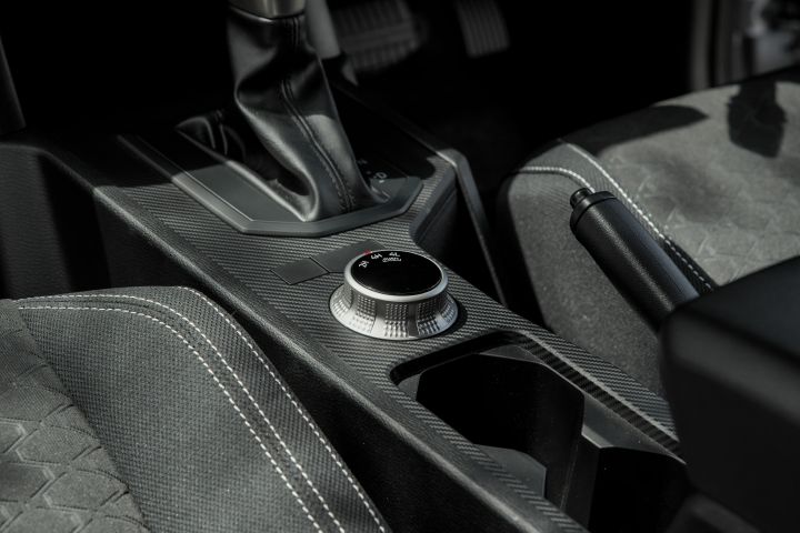 2026 Nissan Navara ST dual cab ute finished in Summit Silver with a close view of the centre console, gear shifter, rotary selector and storage area.