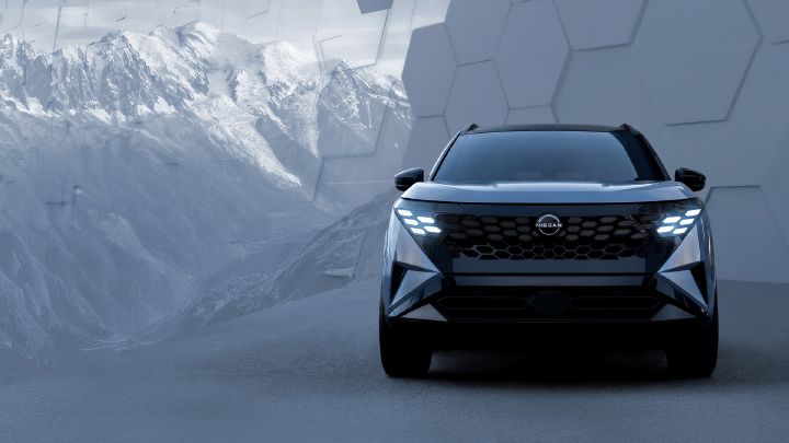 One Nissan Rogue Hybrid e‑POWER front view in front of a backdrop that looks to have mountains and tiles.