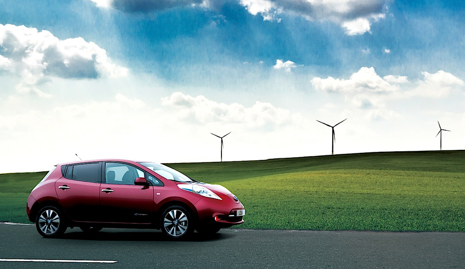 a red Nissan vehicle pictured next to HVLS fans