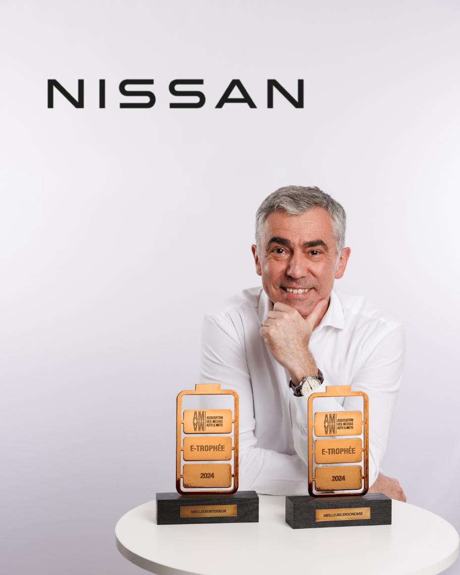 Richard Tougeron posing with the two AMAM eTrophies won by Nissan