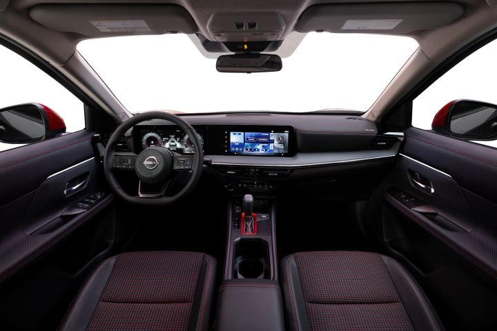 View of the dashboard, steering wheel and door interiors in the 2025 Nissan Kicks.
