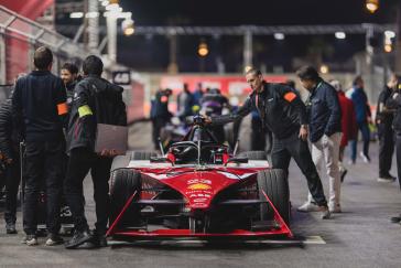 Nissan Formula E team checking car in pits