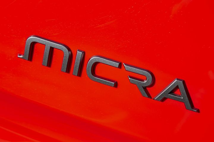 Close-up of the Nissan MICRA badge on the vehicle exterior