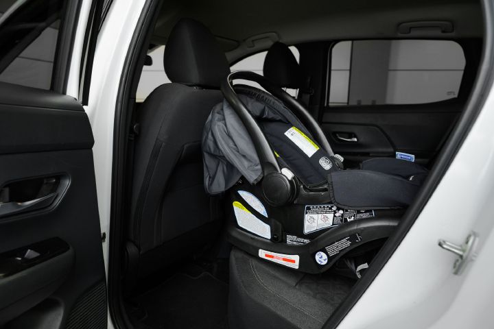 An infant car sear positioned as rear-facing inside the 2026 Nissan Kicks.
