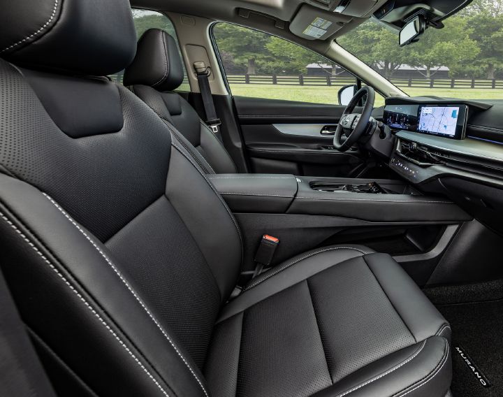 The front seats inside the 2027 Nissan Murano Dark Armor as view from the passenger door.