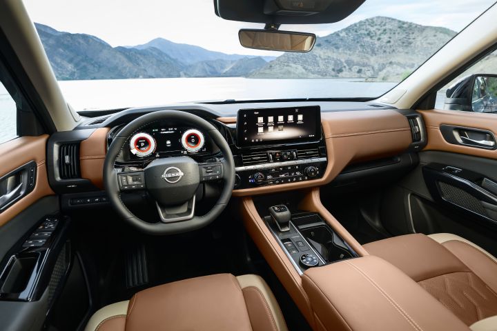 View of the steering wheel, dashboard and windshield inside the 2026 Nissan Pathfinder.