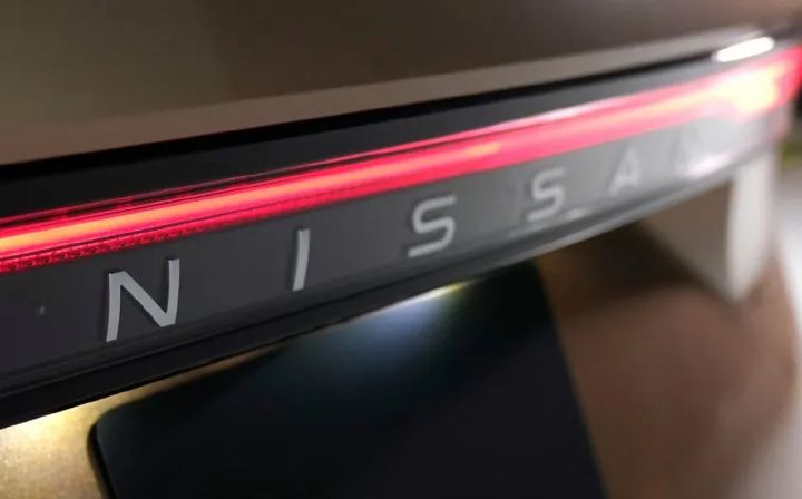 The Nissan logo on the rear of the car body
