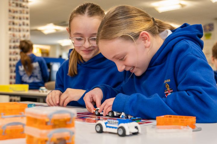 Pupils from Blue Coat School Durham at Monozukuri Caravan assembling lego vehicles