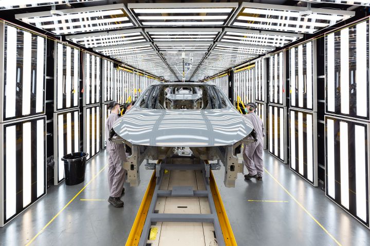 Nissan Sunderland Plant workers inspecting the exterior of Qashqais under construction.