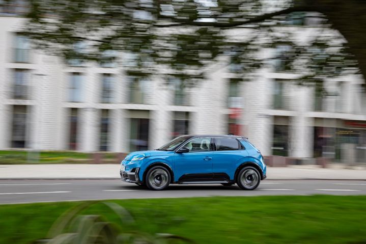 Blue Nissan MICRA side profile on road