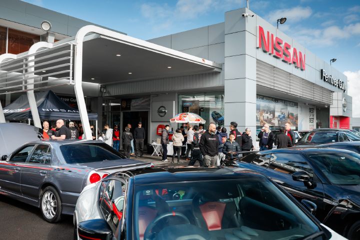 A crowd of people gather outside of Ferntree Gully Nissan to celebrate the opening of the NISMO Performance Center Melbourne.
