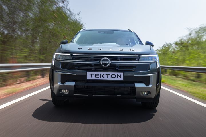 Head-on view of the Nissan Tekton in motion on an open road.