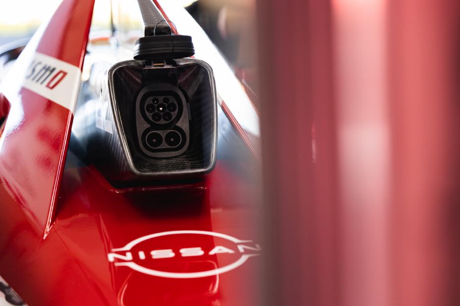 A black charging port on a Nissan Formula E racecar.