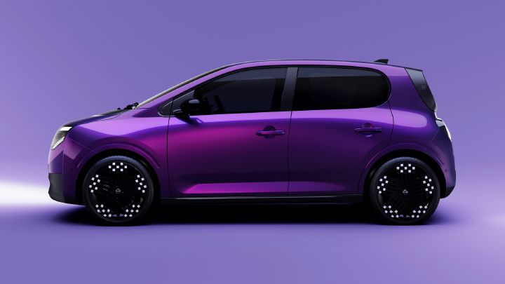Promotional studio photograph showcases a sleek purple compact hatchback in side profile against a matching violet background. Black-tinted windows, aerodynamic bodywork, silver door handles, and distinctive black wheels with white dot accents emphasize modern automotive styling.