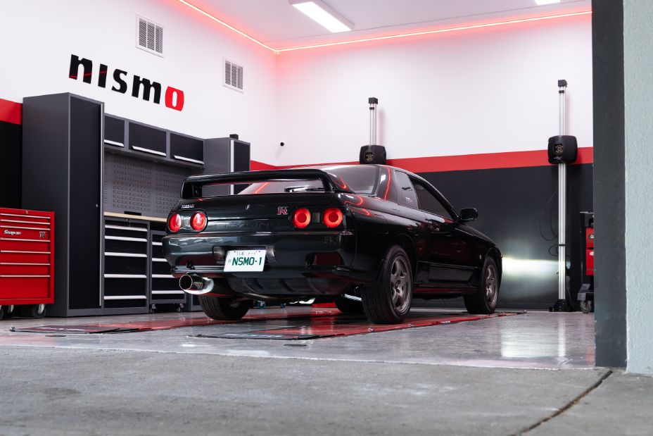 A black R32 GT‑R in the workshop of the new NISMO Performance Centre Melbourne.