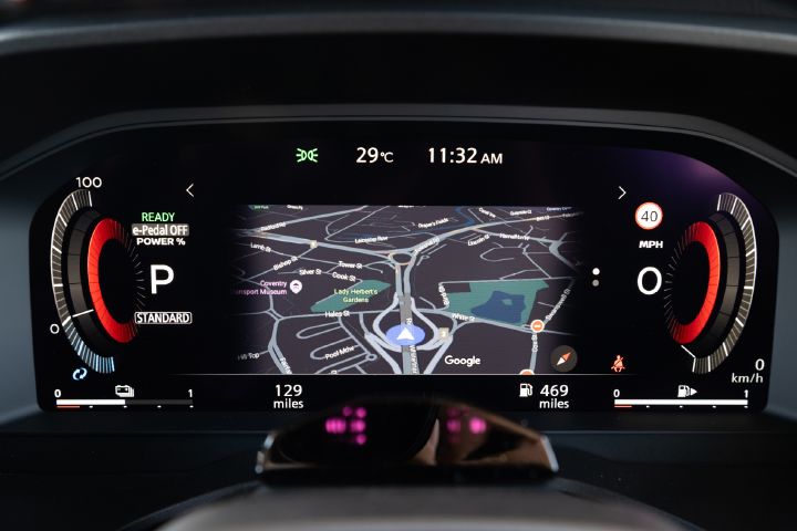 Close-up of the Nissan X‑Trail digital driver display showing navigation guidance.