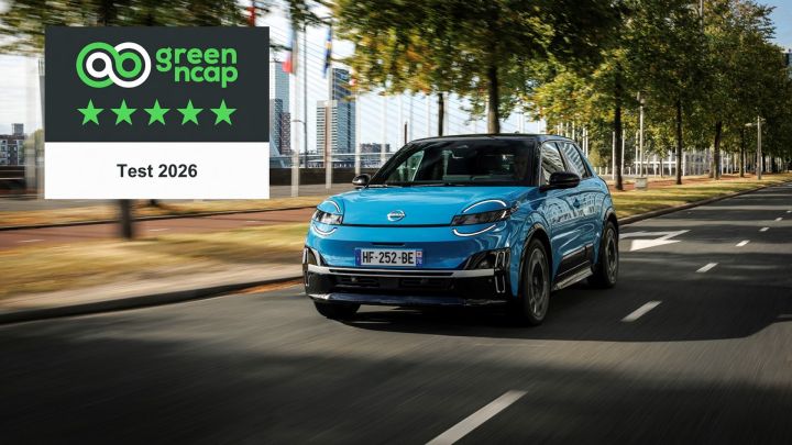 A blue all-new MICRA on the road with the Green NCAP 5 star rating in the top left corner of the image.