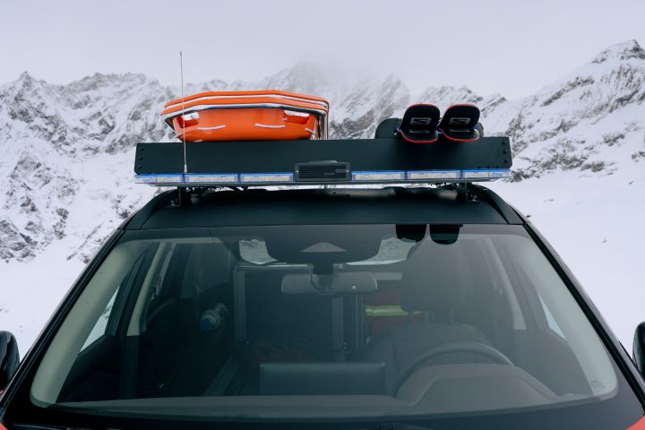 Ski and snow accessories on the roof of Nissan X‑Trail Mountain Rescue,