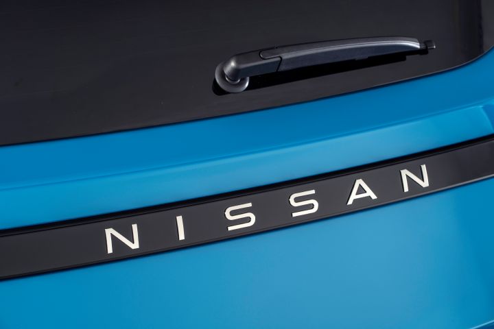 detailed image of NISSAN name plate on rear body of Micra