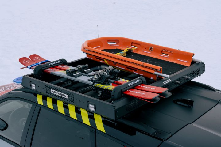 Bespoke roof rack with an evacuation stretcher and snow shovels