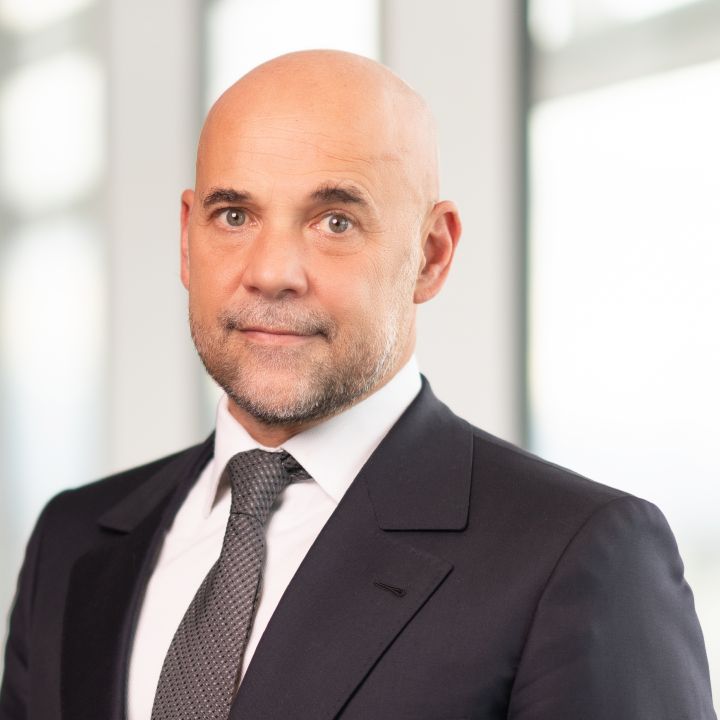 Portrait of Guillaume Cartier (suit, tie and NISSAN corporate pin)