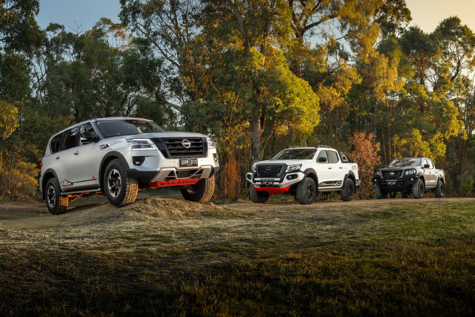 Nissan Australia vehicle model range line-up of Nissan Patrol Warrior and Nissan Navara Warrior on grassy hill