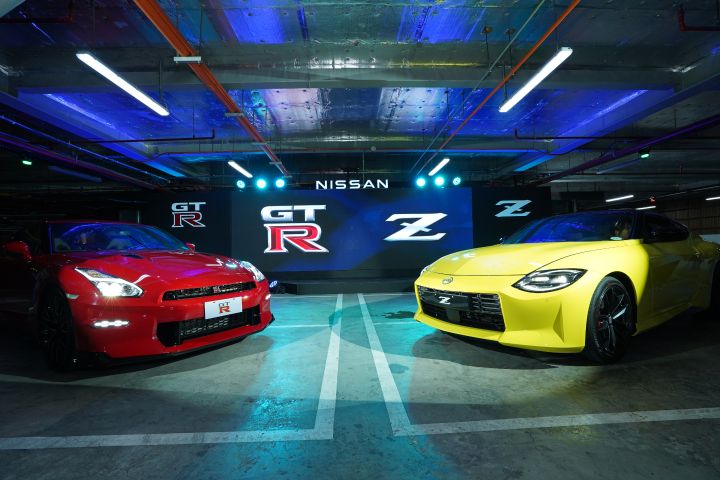 The New GT‑R and the All -New Nissan Z parked in a parking lot