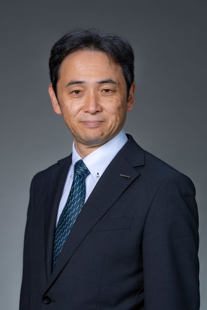 Portrait of Eiichi Akashi (suit, tie and NISSAN corporate pin)