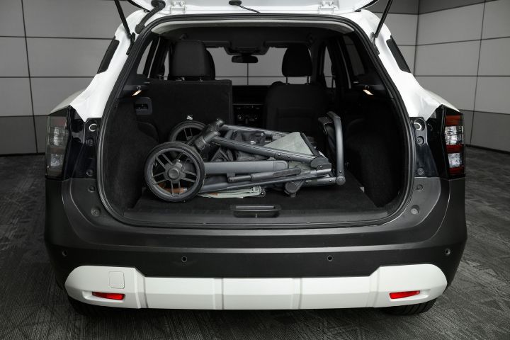A stroller inside the trunk of the 2026 Nissan Kicks.