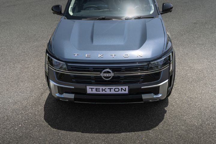Elevated front view of the Nissan Tekton showcasing the bonnet design, grille and model badging.