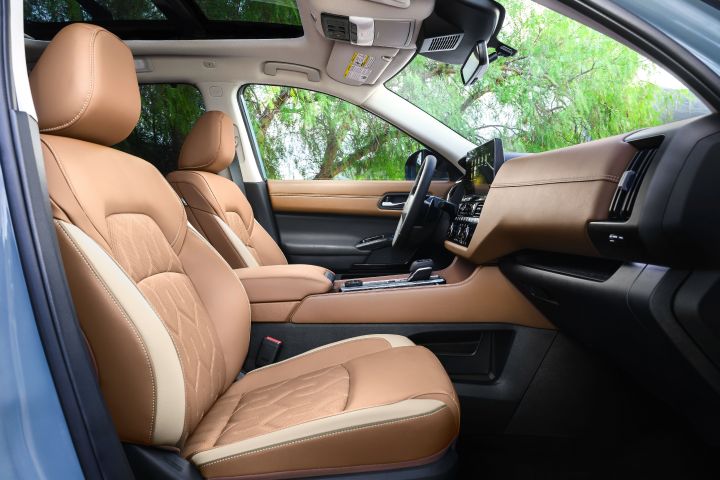 The passenger and driver seats inside the 2026 Nissan Pathfinder as viewed from the front passenger door.