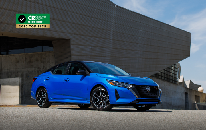 Front right ¾ view of a blue 2025 Nissan Sentra with an award stamp in the top left corner of the background.