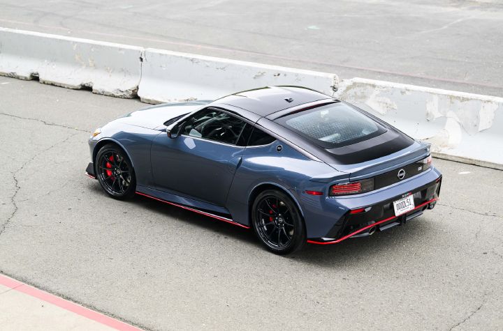 Angled, high level view of the 2027 Nissan Z NISMO Manual Transmission parked on a racetrack.
