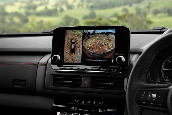 2026 Nissan Navara PRO-4X finished in Boulder Grey highlighting the dashboard screen with surround-view camera system, split-screen terrain monitoring and guidance lines.