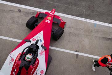 Overhead view of a Nissan Formula E car parked.