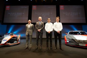 Four people on stage Formula E season 6 kick-off event