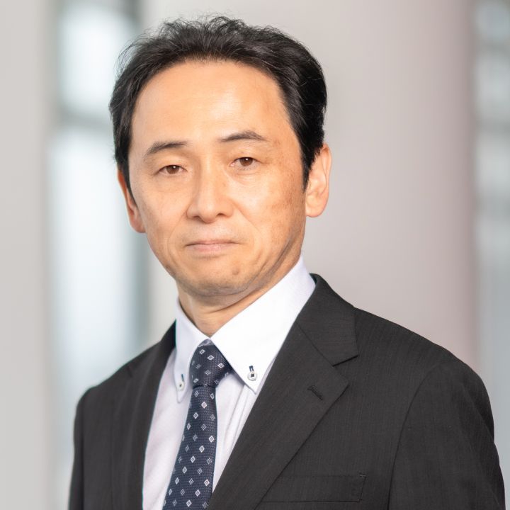 Portrait of Eiichi Akashi (suit, tie and NISSAN corporate pin)