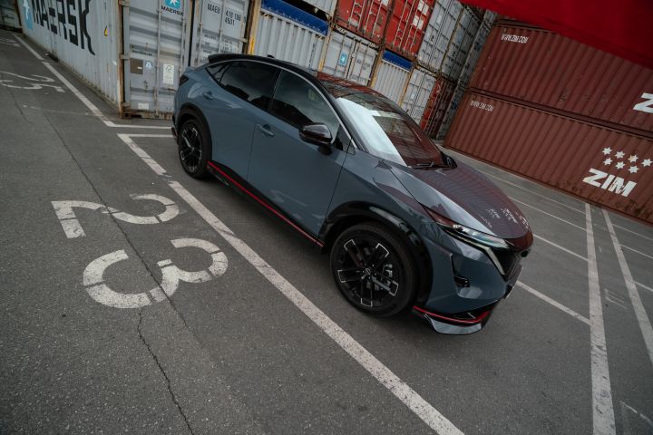 Static side shot of the Ariya NISMO in a parking spot with the label 23 on the ground