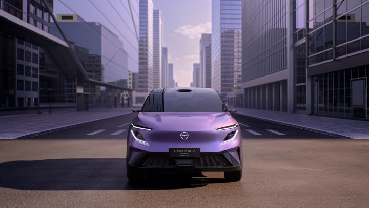 An Urban SUV PHEV Concept stopped on a city street. The purple-toned SUV is shown from a front view, with tall buildings lining the background.