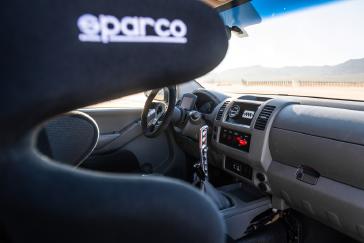 A photo of the dashboard and steering wheel in the Frontier Desert Runner