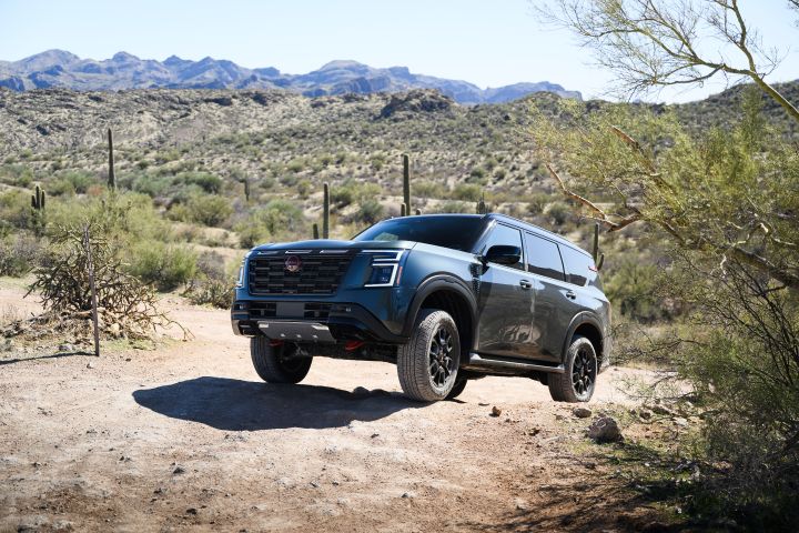 A 2025 Nissan Armada PRO-4X parked at an incline on a rocky pathway.