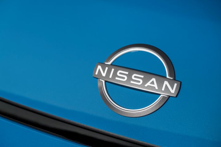 detailed Nissan logo nameplate on Blue micra body