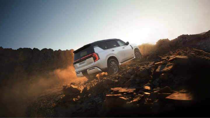 All-New Nissan Patrol climbing a steep mountain trail.