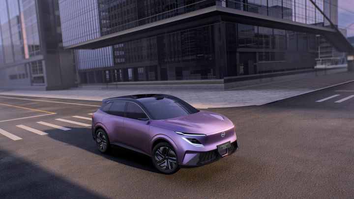A purple Urban SUV PHEV Concept viewed from a front three-quarter angle, driving to the right on a city street near an intersection, with buildings in the background.