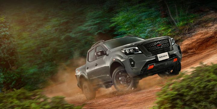 A photo of Nissan Navara driving on a road