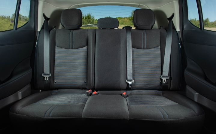 View of the dark cloth rear passenger seats inside the 2025 Nissan LEAF.