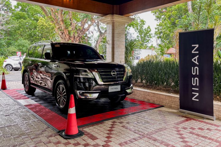 A black Nissan Patrol parked in a parking lot