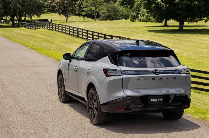 Angled rear view of the 2027 Nissan Murano Dark Armor parked on a country road.